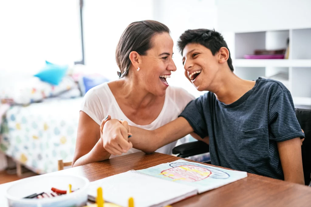 Two people laughing with each other